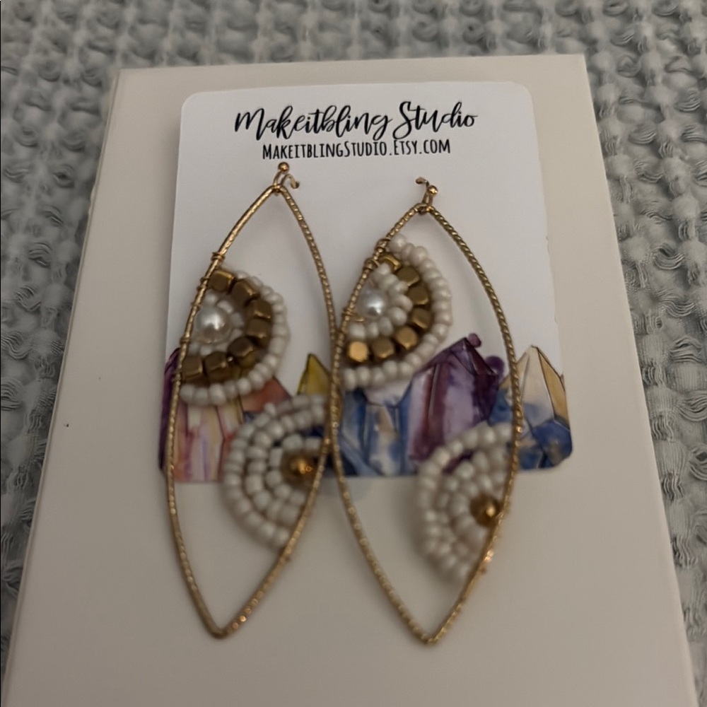Gold and White Teardrop Earrings with Intricate Beadwork